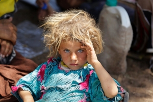 Yazidi girl rests after fleeing ISIS